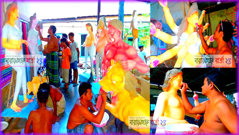 ` রঙ তুলির আঁচড়ে সাজছে প্রতিমা ’
